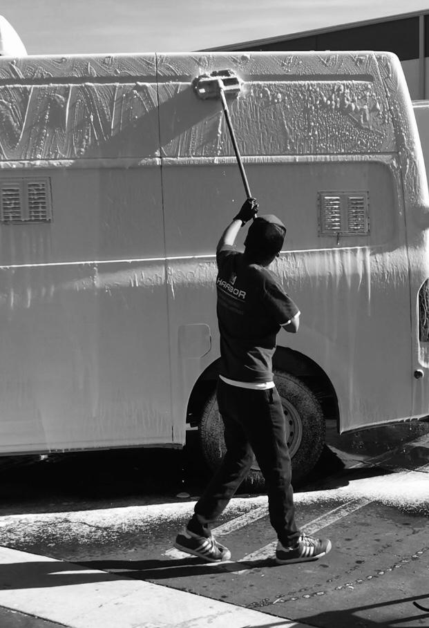 Harbor crew washing a company fleet vehicle