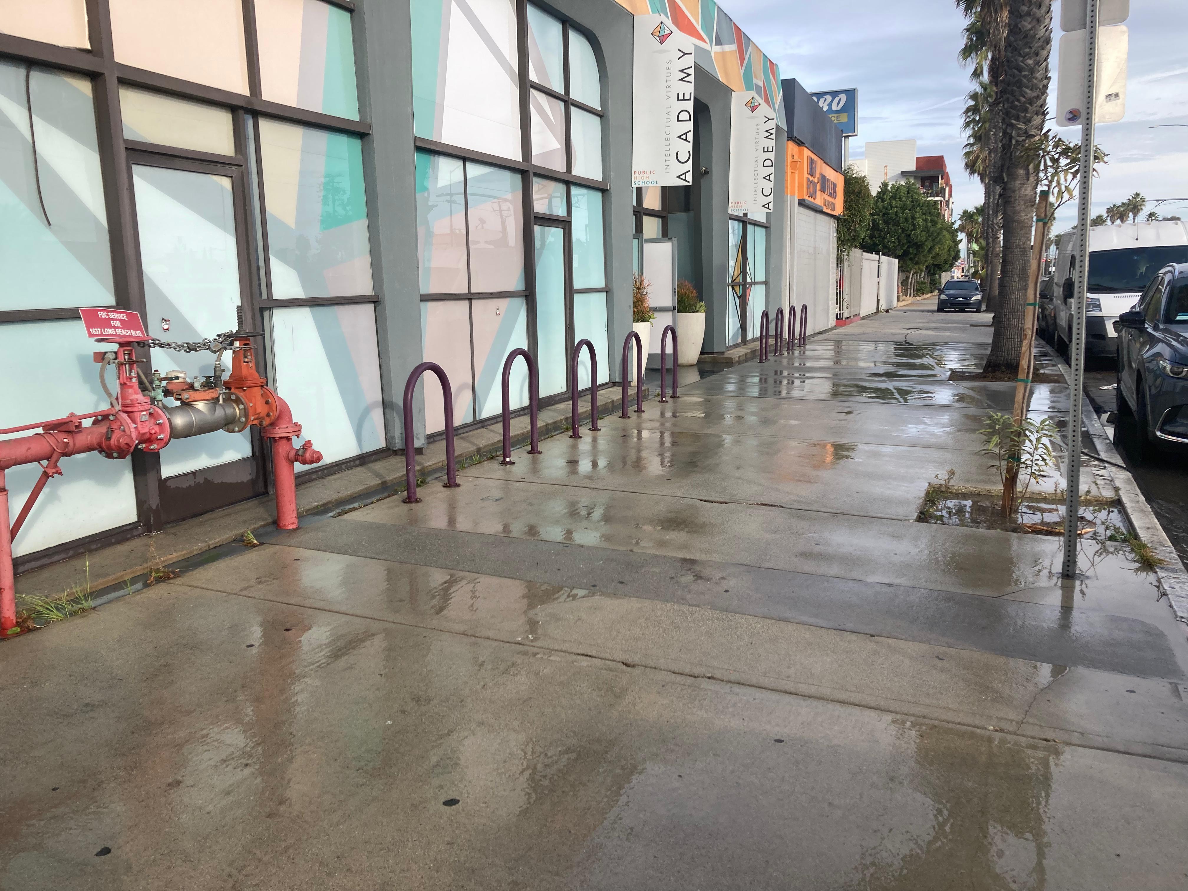 Clean sidewalk and bike racks after power washing